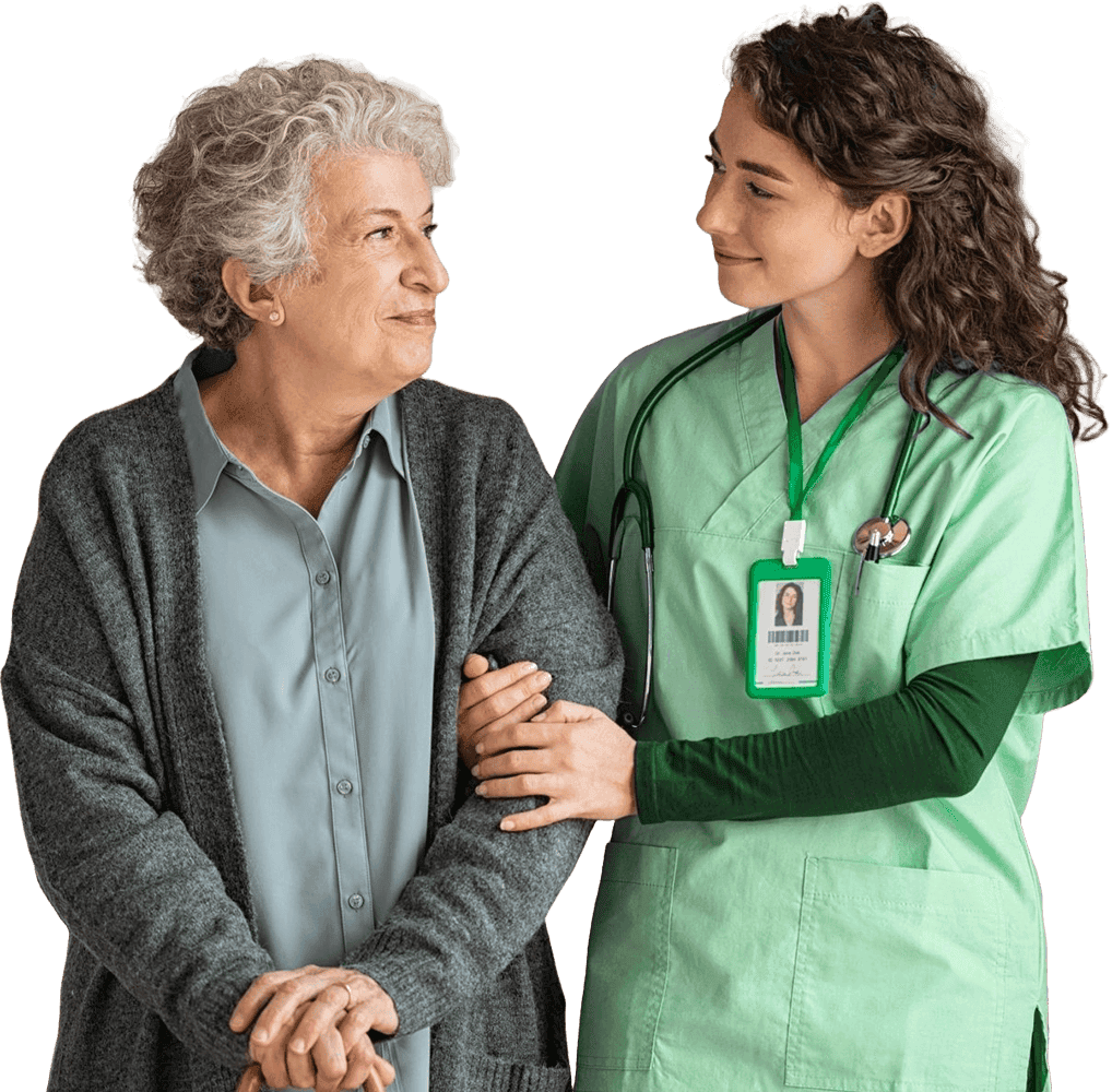 Pflegekraft von Ihr Team 24 stützt lächelnde Seniorin mit grauen Haaren – Symbol für Vertrauen und Fürsorge